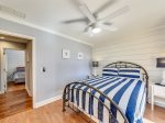 Guest Bedroom with TV and Back Deck Access at 16 Sea Oak Lane